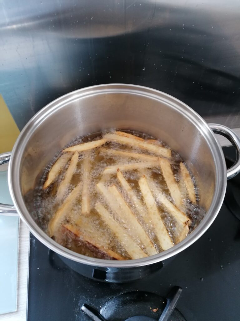 Deep frying beer battered fish