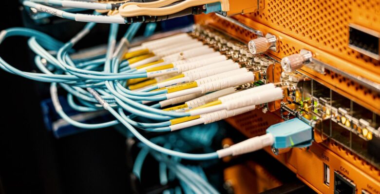 Modern hardware and structured cabling system with patch cords inserted into patch panel outlets
